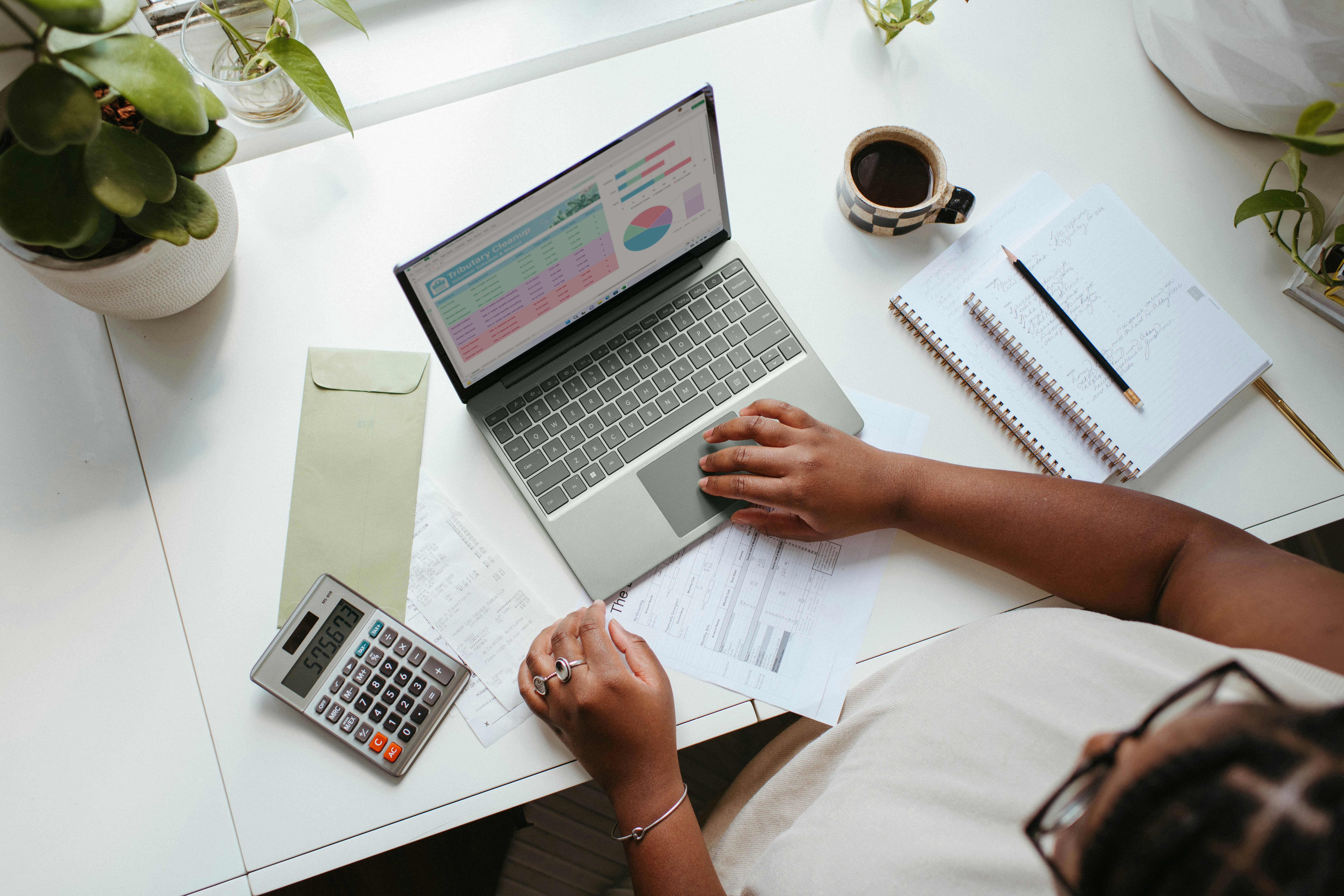 freelancer working to budget on irregular income with spreadsheet